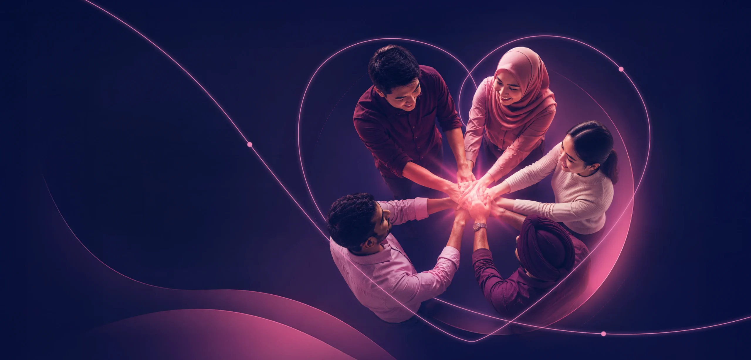 Team members placing hands together symbolising unity and empowerment
