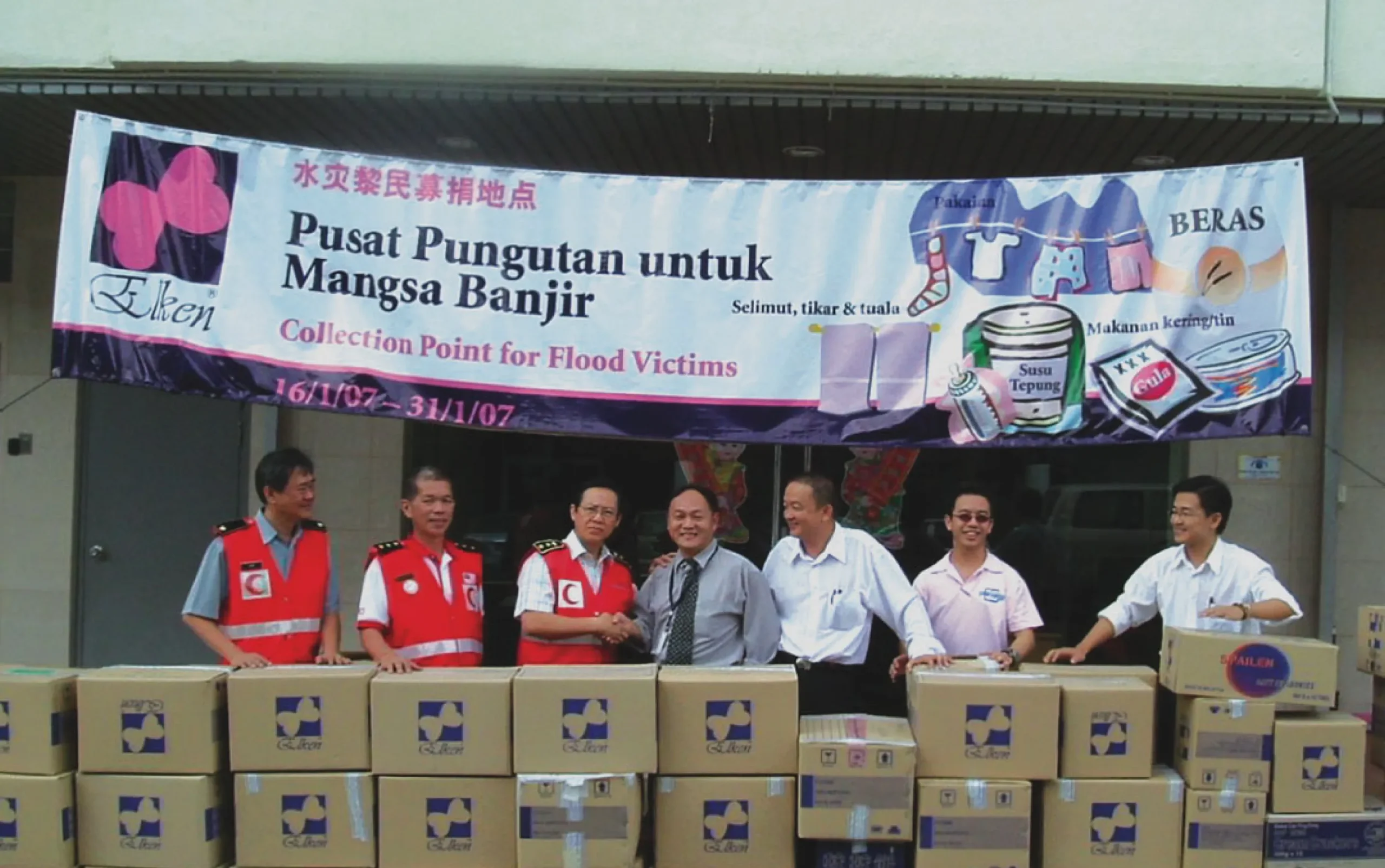 Volunteers distributing flood relief supplies to affected communities